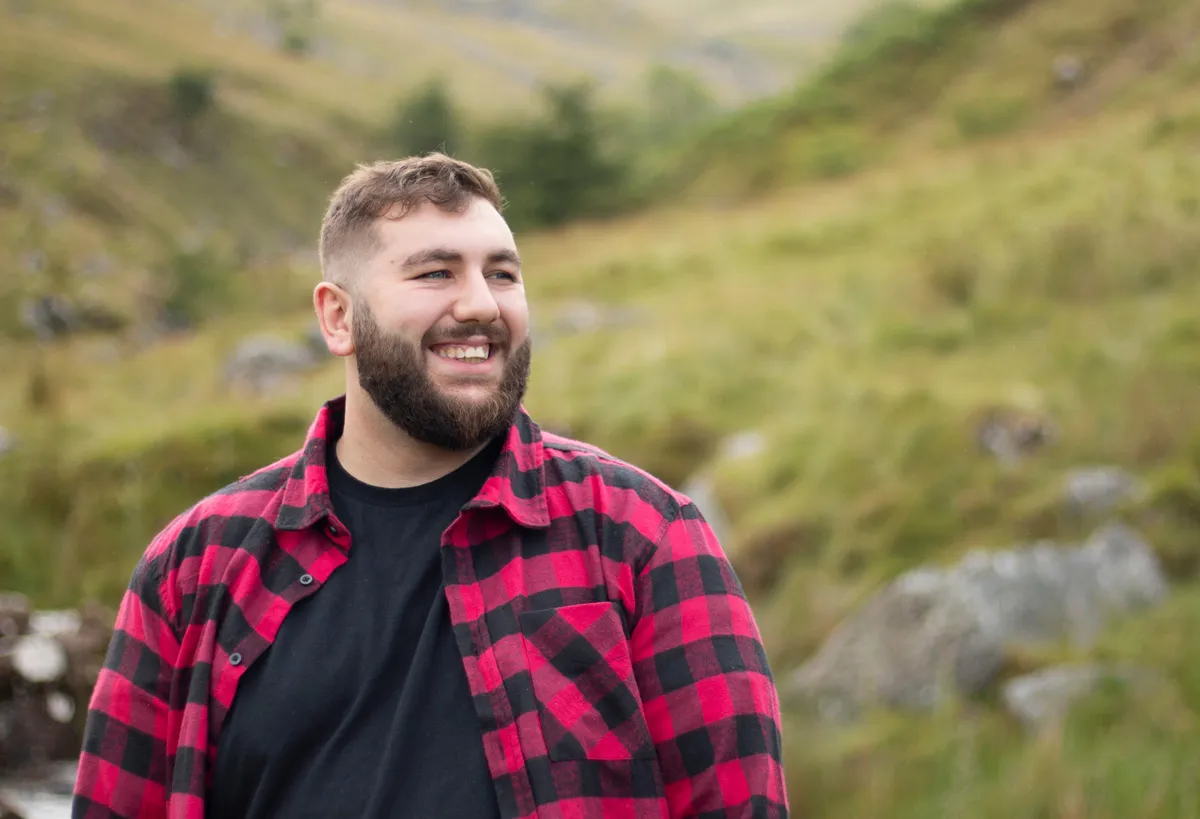 Happy man on a hike in the mountains